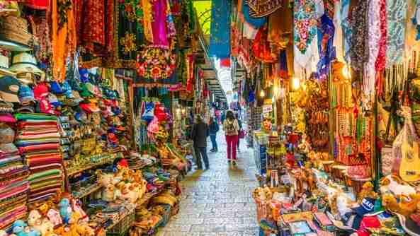 people walking through the jerusalem shuk