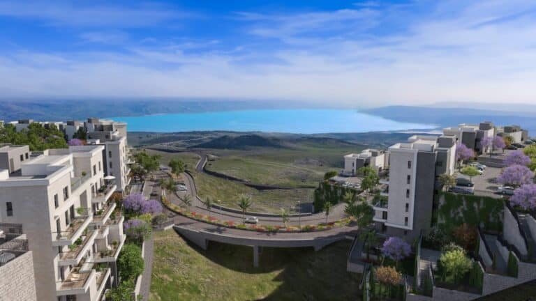 The image depicts a modern residential area with several multi-story buildings. The architecture features clean lines and large windows, with some buildings having balconies adorned with plants. Th...