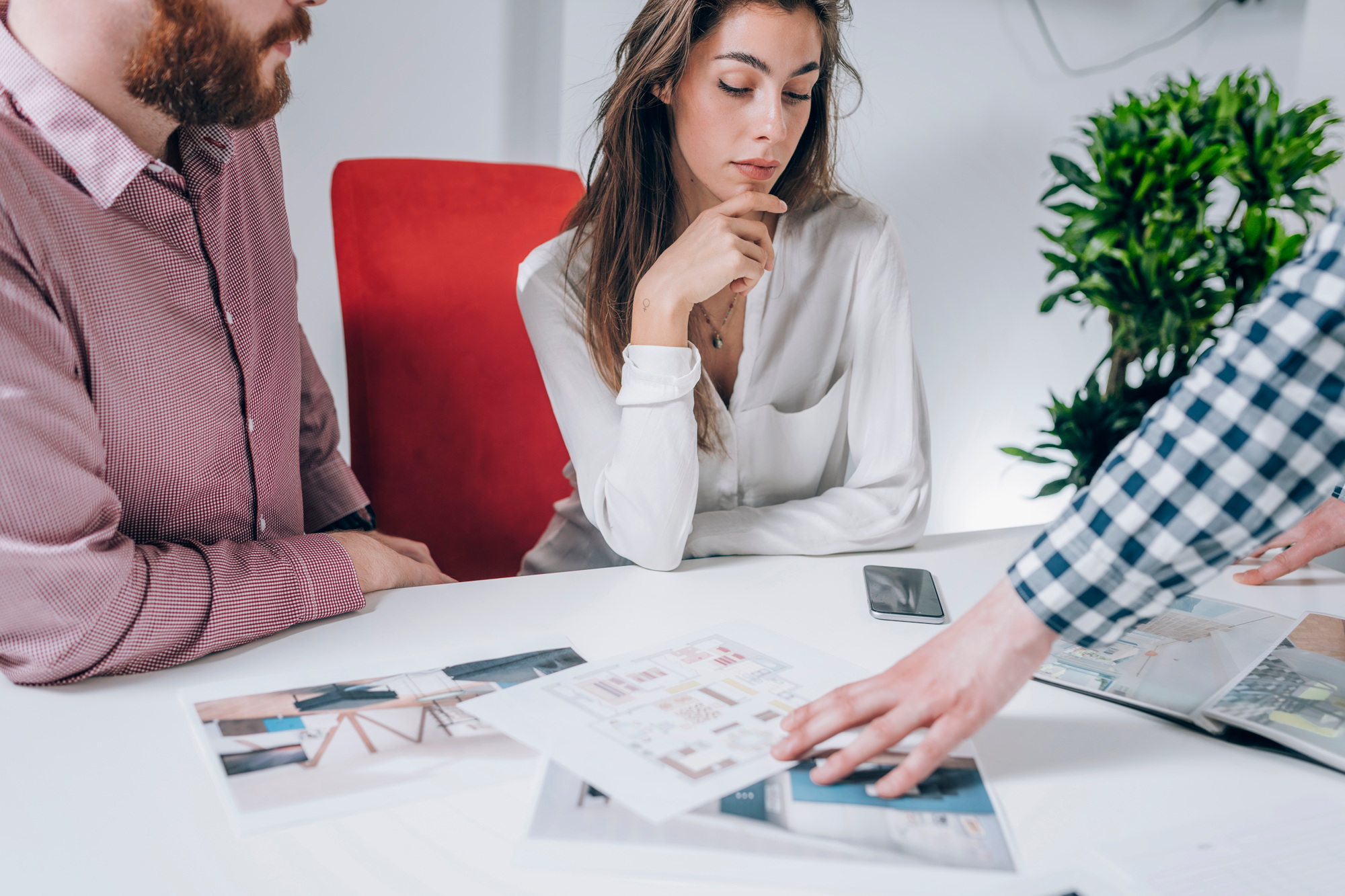 Couple in Real-Estate Agency Talking to Real Estate Agent