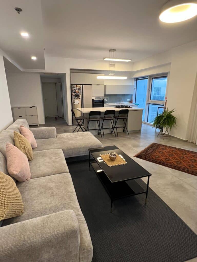 Living, dining and kitchen area at the Midtown Tel Aviv apartment
