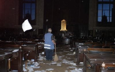 abandoned courtroom with glowing model tower in israel