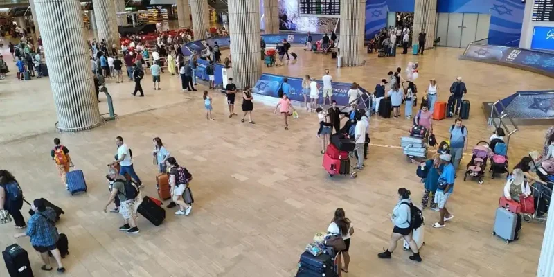 Anglo families arriving at Ben Gurion Airport with luggage during relocation to Israel