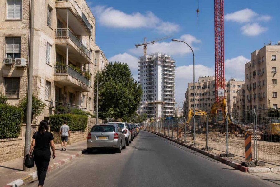 Modern apartment buildings and a light rail construction corridor in Holon, Israel