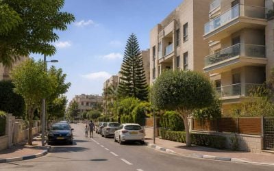 Modern apartment buildings and tree-lined residential street in Ra'anana