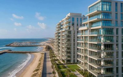 Modern beachfront apartment buildings near the Herzliya coastline with balconies and sea views