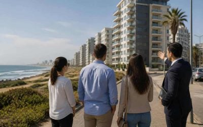 Modern apartment buildings near the Ashdod coastline with buyers viewing the neighborhood