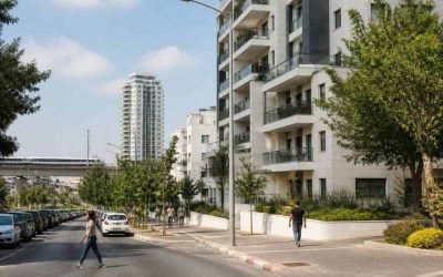 Modern apartment buildings and a tree-lined urban street in Holon near central Israel transit corridors