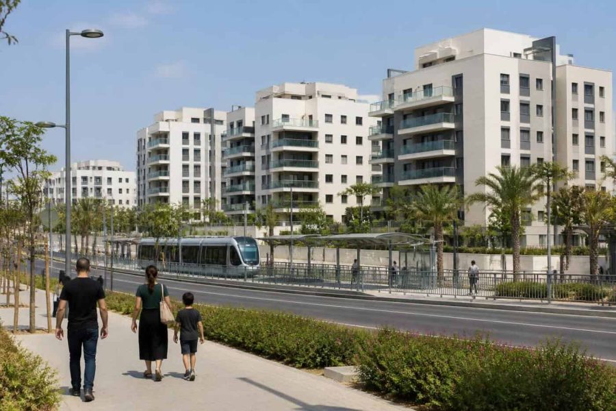 Modern apartment buildings and a train station area in Ofakim, Israel