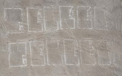 chalked building plans on dusty ground in israel