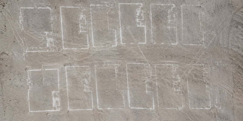 chalked building plans on dusty ground in israel