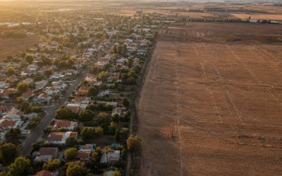golden hour aerial of israel town expansion