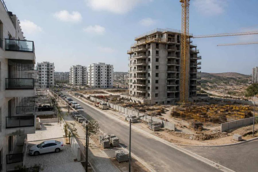 New residential apartment towers and surrounding infrastructure under construction in an Israeli neighborhood