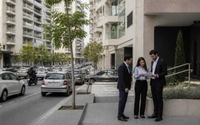 Modern apartment buildings in Israel viewed from a city street during a property sale