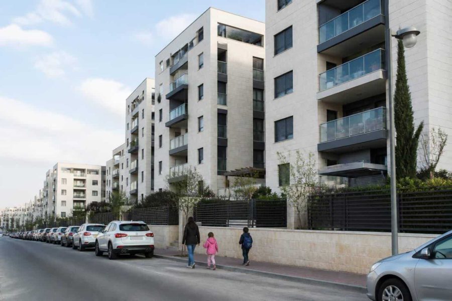 Residential apartment buildings in Israel viewed from a street in a quiet urban neighborhood