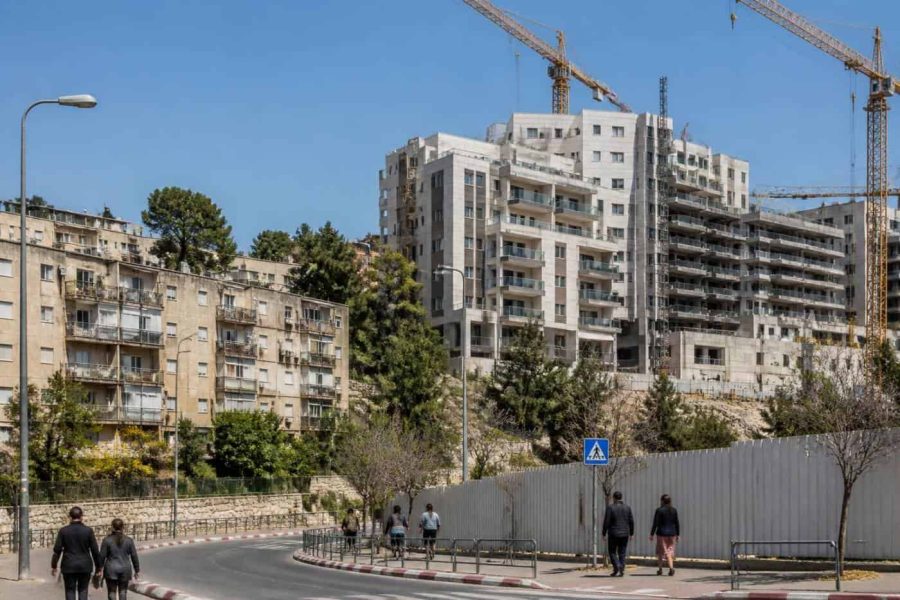 Modern residential redevelopment construction scene in a Jerusalem hillside neighborhood