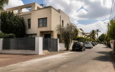 Residential street with private homes in Kfar Yona during a real estate auction deadline