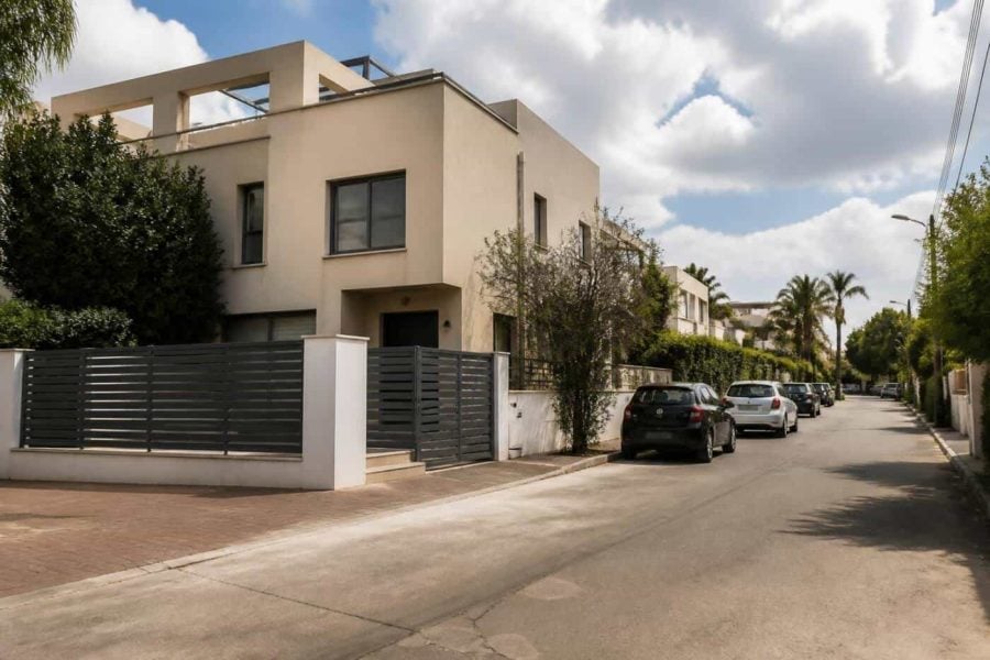 Residential street with private homes in Kfar Yona during a real estate auction deadline