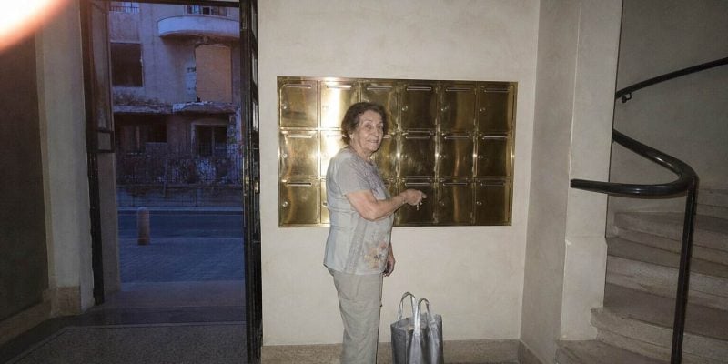 mailbox moment in the entrance hall with an old lady in israel