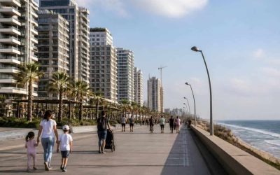 Modern apartment buildings along the Netanya coastline with residential neighborhoods and the Mediterranean Sea nearby