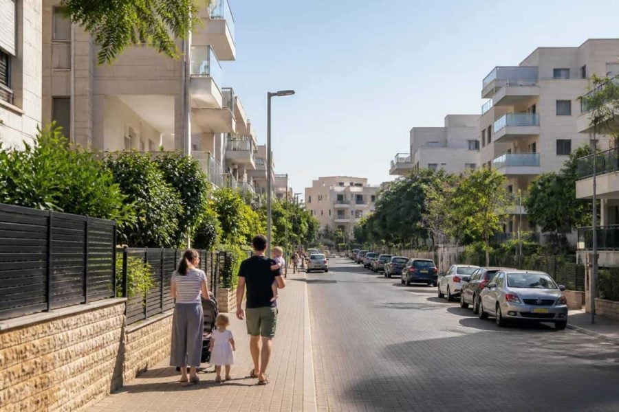 Residential apartment buildings and tree-lined streets in a suburban Israeli city