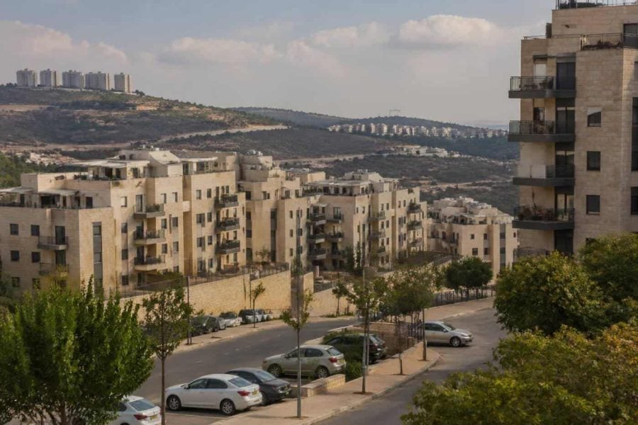 Modern apartment buildings in Ramat Beit Shemesh with residential streets and hillside surroundings