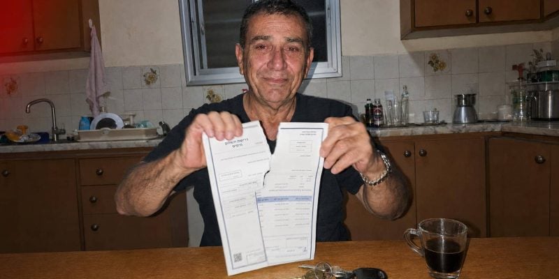 relieved man in old kitchen