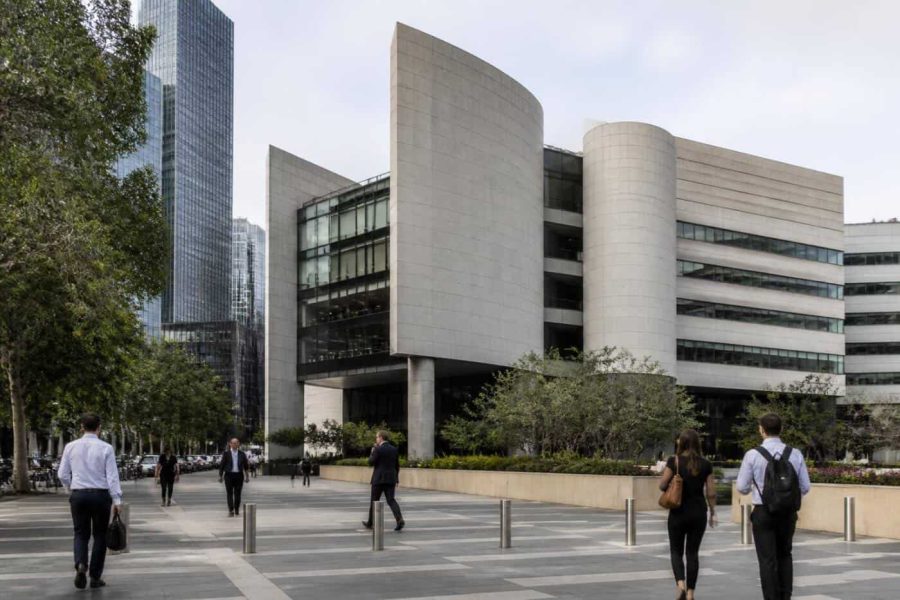 Bank of Israel building with people walking nearby in a modern urban financial district