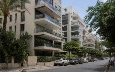 Modern Tel Aviv apartment buildings viewed from a quiet residential street