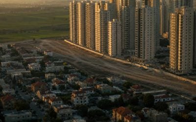 urban sprawl meets open fields at dusk