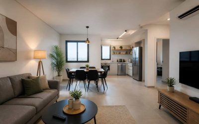 Modern furnished apartment interior in Israel with living room furniture and kitchen appliances