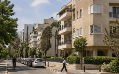 Mid-rise apartment buildings on a tree-lined residential street in Givatayim