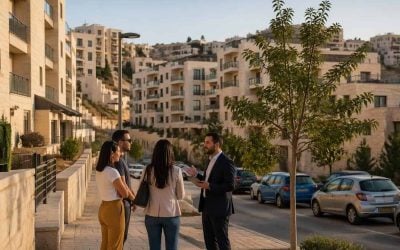 Modern residential apartment buildings in a Jerusalem neighborhood with buyers viewing properties