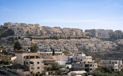 Wide view of Israeli hillside residential neighborhood with modern apartment buildings and homes