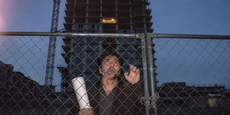 worried man at construction site at dusk in israel
